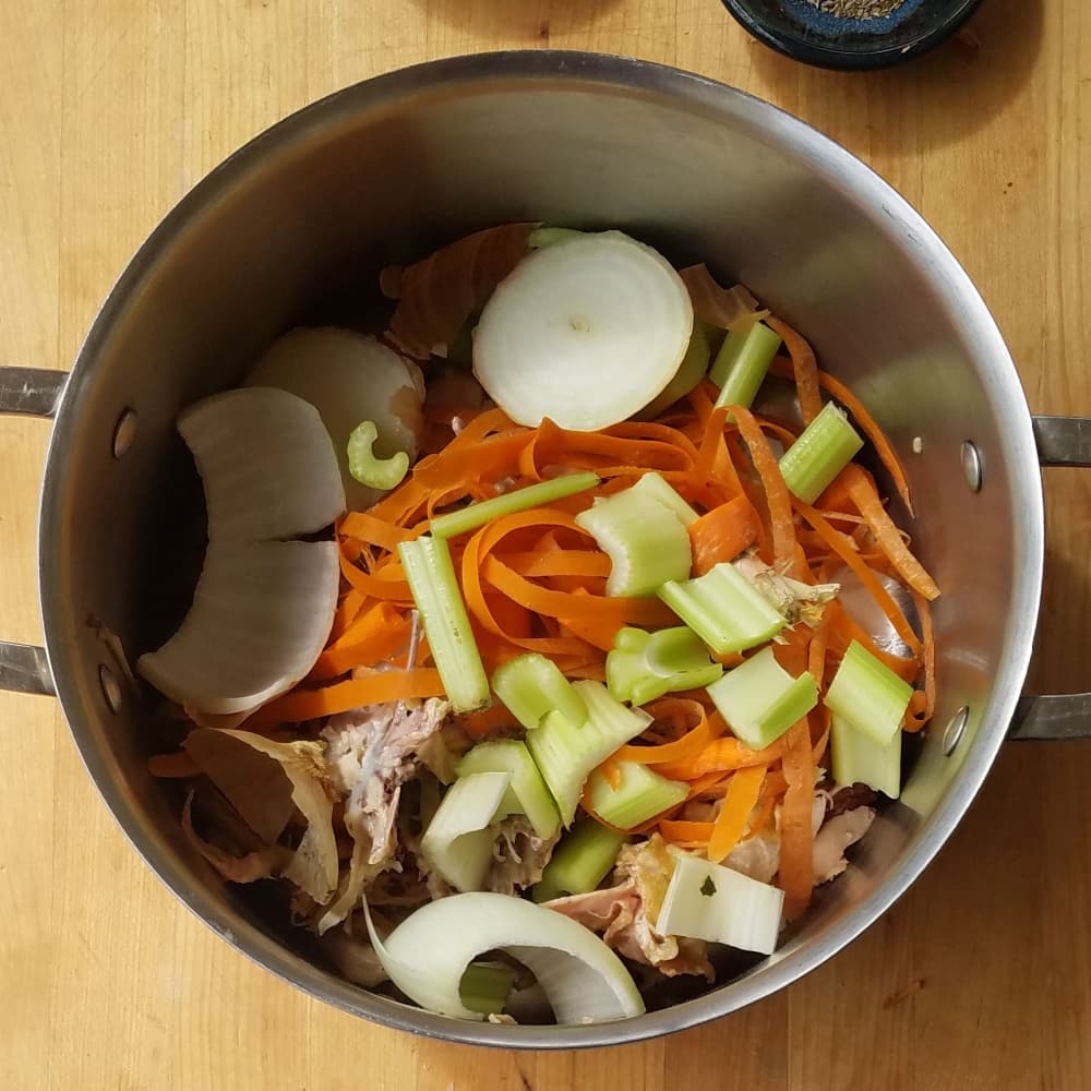 Vegetable scraps in large stockpot. 