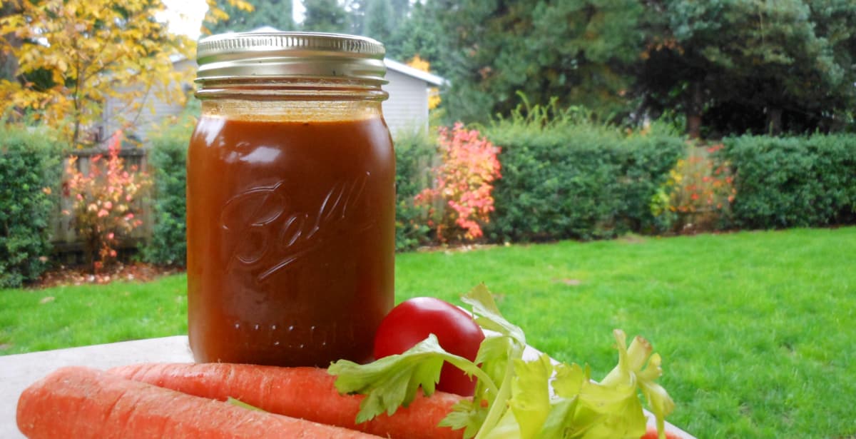 Thick vegetable stock in a quart-size Mason jar.