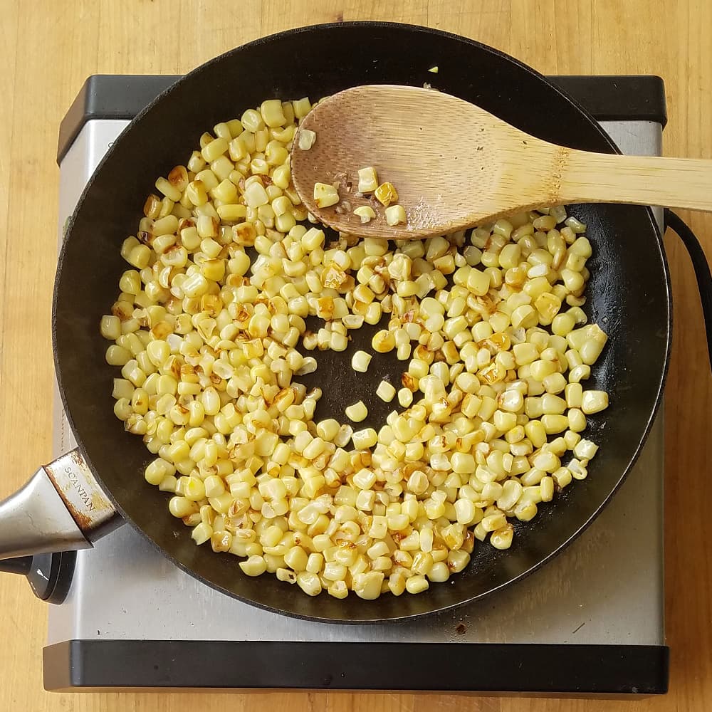 Corn browning in saute pan. 