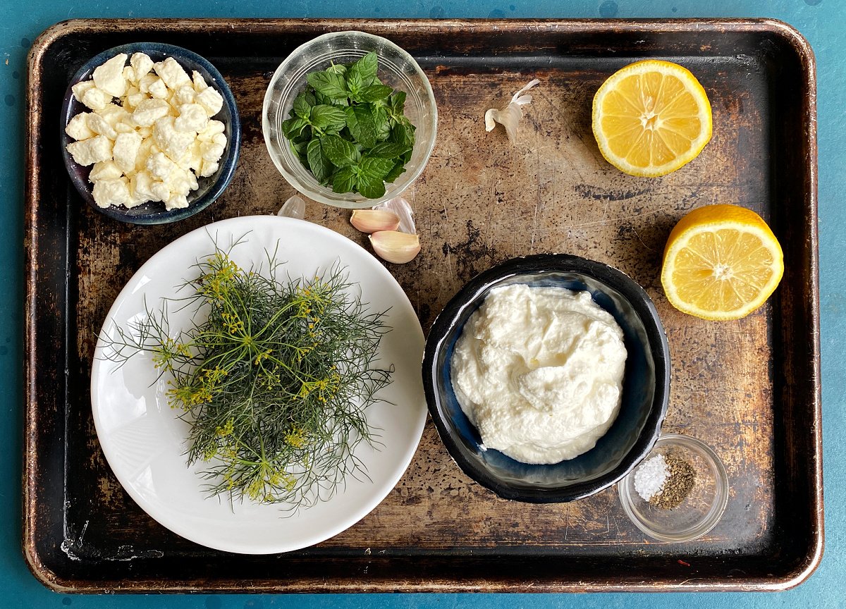 Ingredients for making dill sauce: Feta, fresh mint, lemon, Greek yogurt,  fresh dill, garlic, seasonings.  