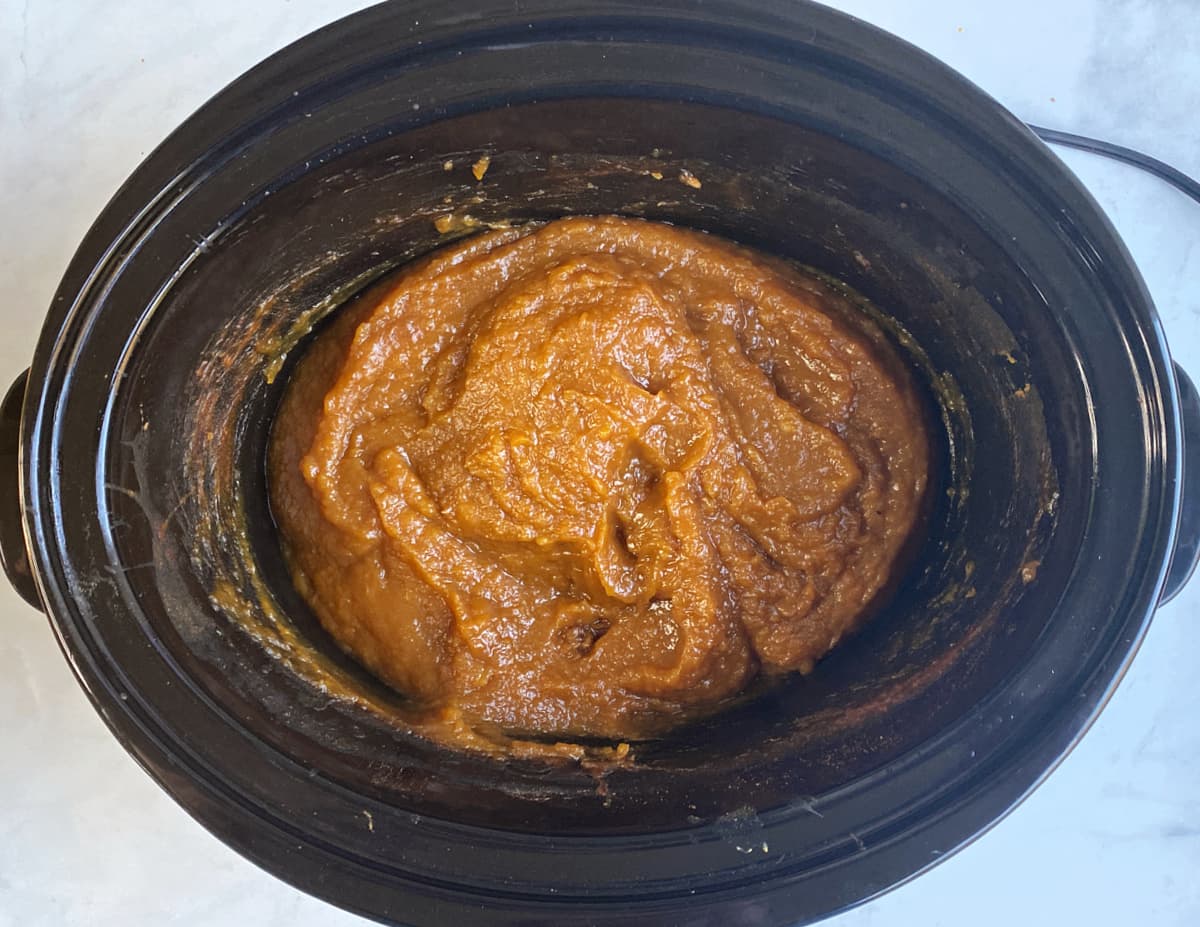 Fully cooked pumpkin butter in slow cooker.