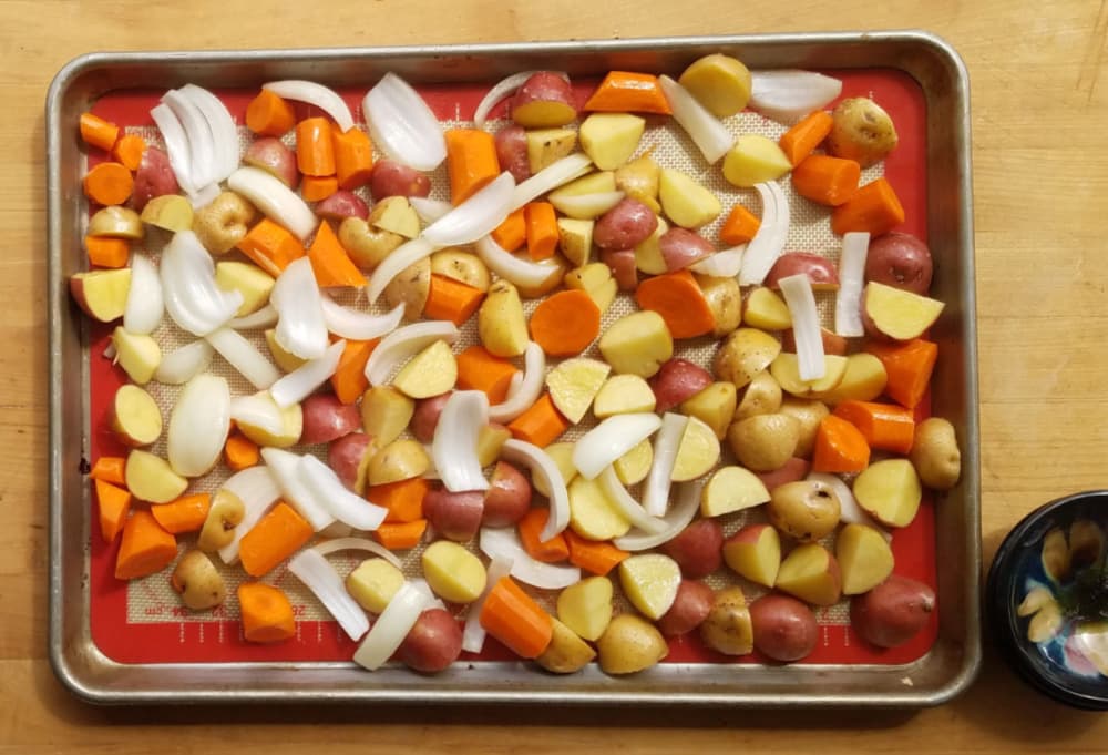 Tray of raw vegetables on baking tray.