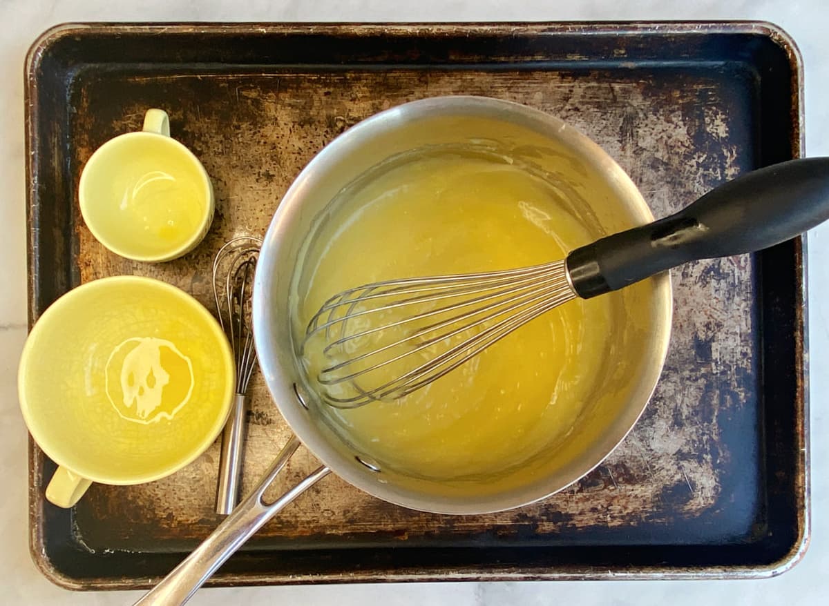 Lemon curd in a sauce pan.