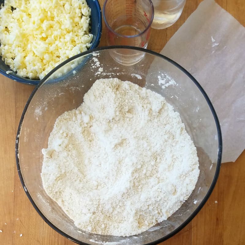 Shortening mixed into flour and salt, in a large glass mixing bowl. 