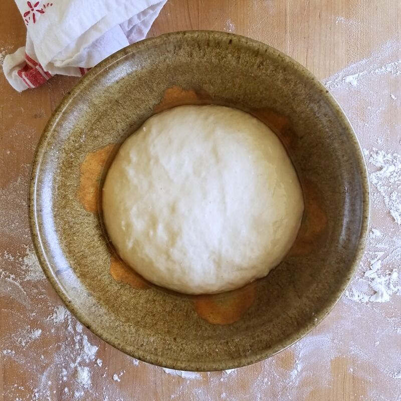 Formed boule placed in oiled bowl. 