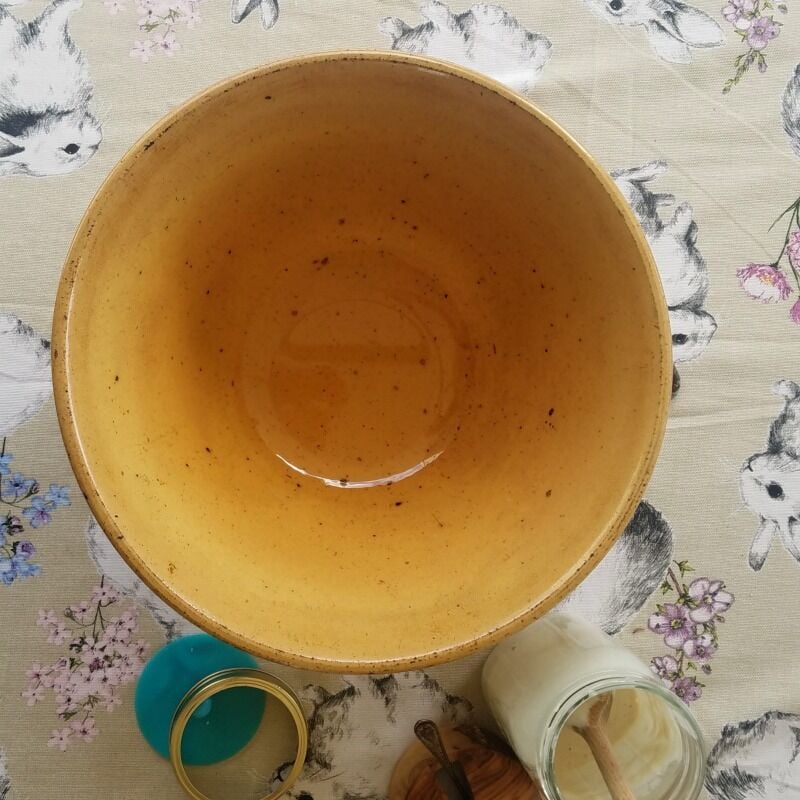 Large, empty crockery bowl, oiled.