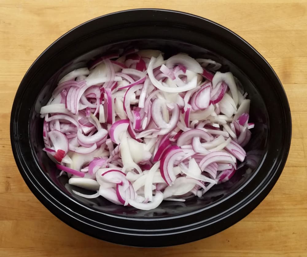 sliced onions in slow cooker