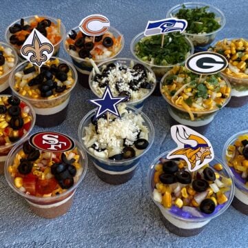 Individual 7-layer dips, made in 7 NFL team colors, including the Cowboys, 49ers, Vikings, Packers, Bears, Seahawks, and Saints.