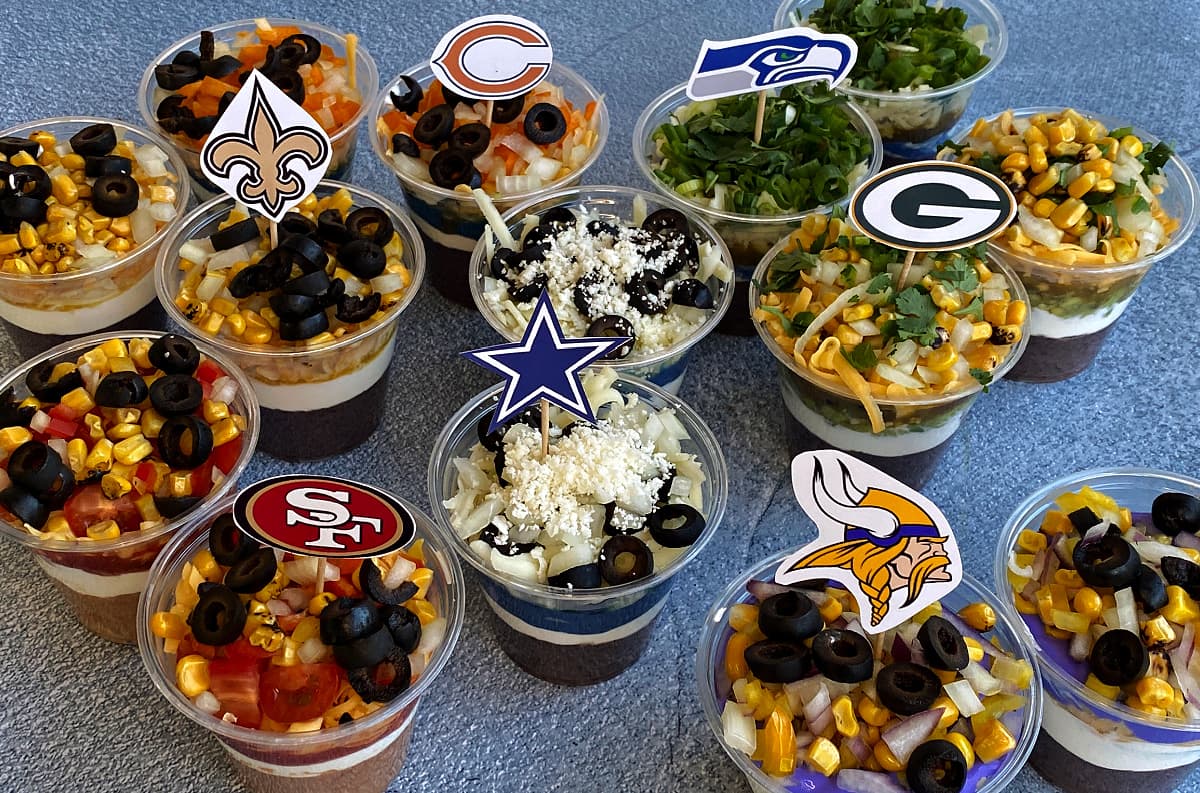 Individual 7-layer dips, made in 7 NFL team colors, including the Cowboys, 49ers, Vikings, Packers, Bears, Seahawks, and Saints.