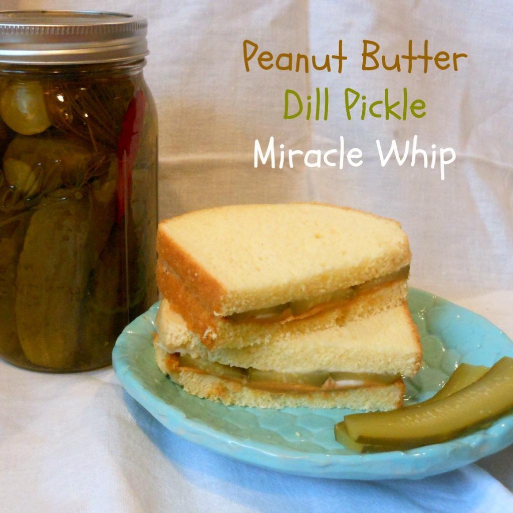 Peanut Butter & Dill Pickle Sandwich on a plate, with a jar of dill pickles to the side. 