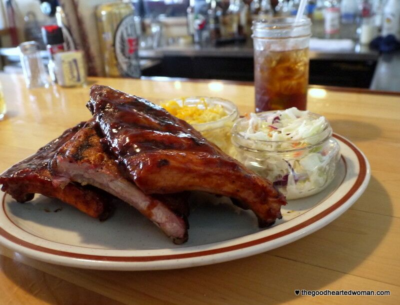 Plate of ribs with corn and coleslaw.