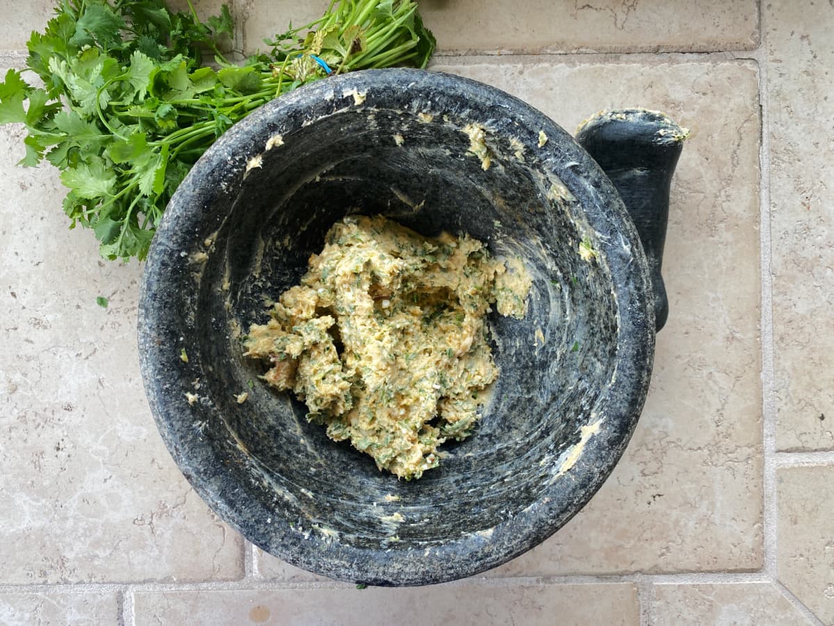 mixed compound butter in a mortar & pestle.