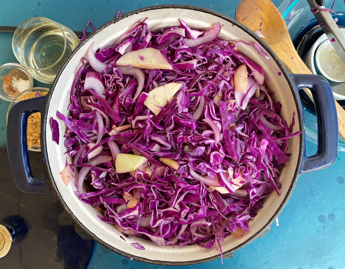 Red cabbage, bacon, onions, and apples. 