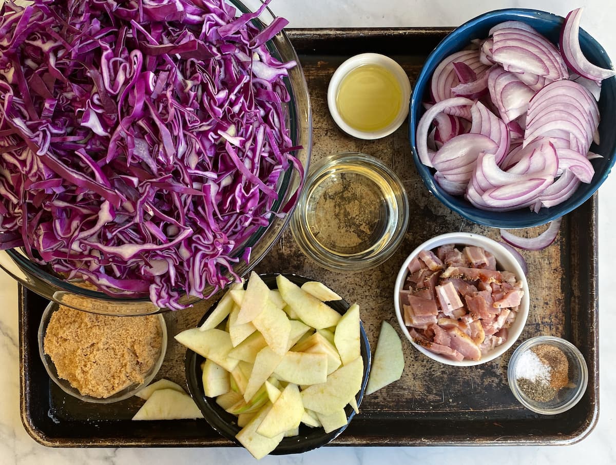 German Red Cabbage ingredients: red cabbage, onions, apples, bacon, brown sugar, cider vinegar, oil, and spices.  