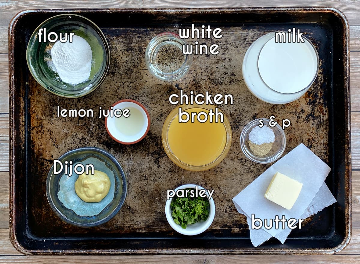 Dijon sauce ingredients: flour, white wine, milk, lemon juice, Dijon mustard, parsley, butter, and salt & pepper.
