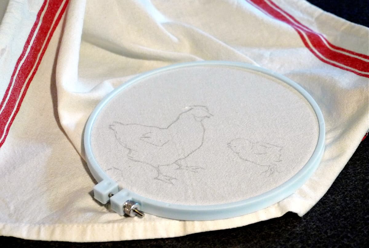 Sketch of chicken and chick penciled on a muslin tea towel. 