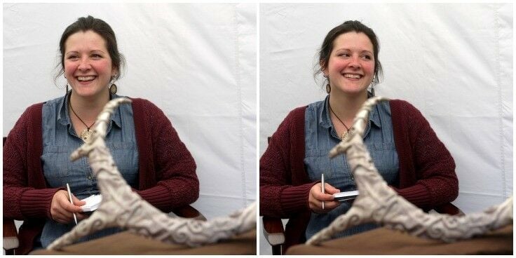 Woman smiling in a market booth. 