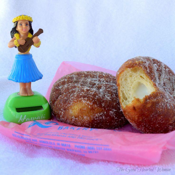 Leonard's Malasadas (Portugese donuts) with a solar powered hula girl next to them. 