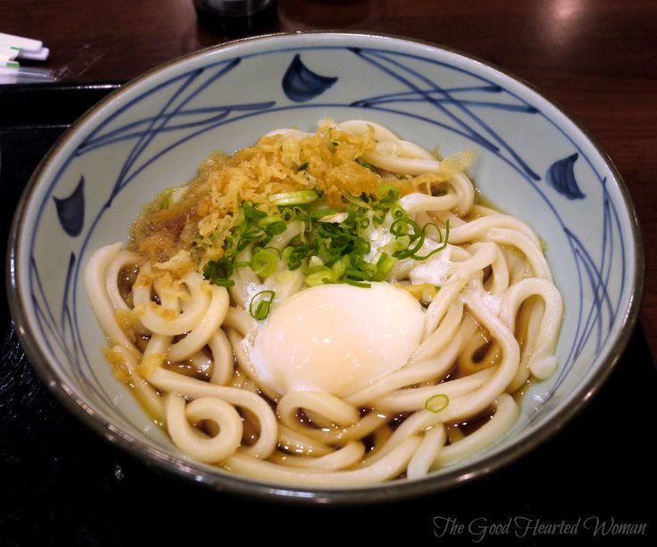 Udon noodles topped with a poached egg, at Marukame Udon.