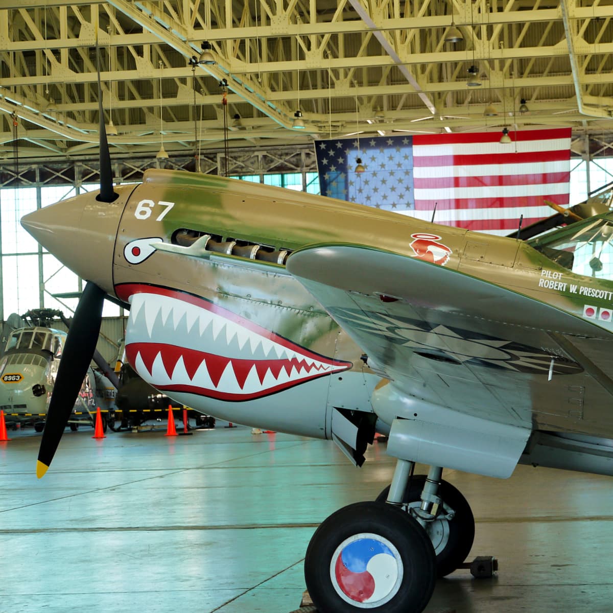 Front end of a restored Flying Tigers airplane from WWII. Nose painted to look like a mouth with sharp teeth. 