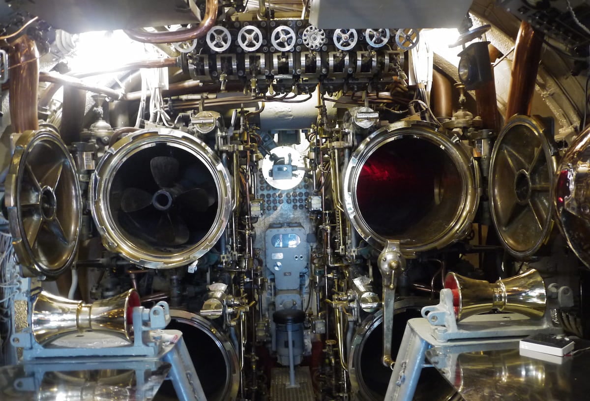 Torpedo tubes, open in torpedo room. 