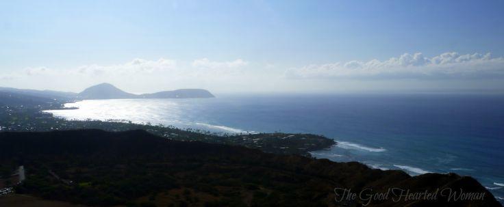 Maunaloa Bay, from the top of Diamond Head. Sun reflecting on ocean water. 