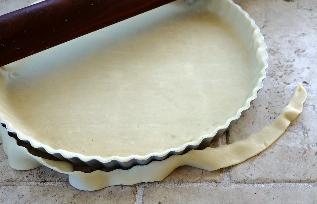 Pastry rolled and cut in tart pan. 