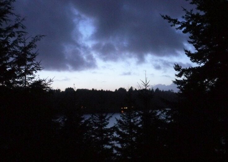 Night scene; view from our balcony to D-Lake. Clouds overhead, clear skies above the treeline. 