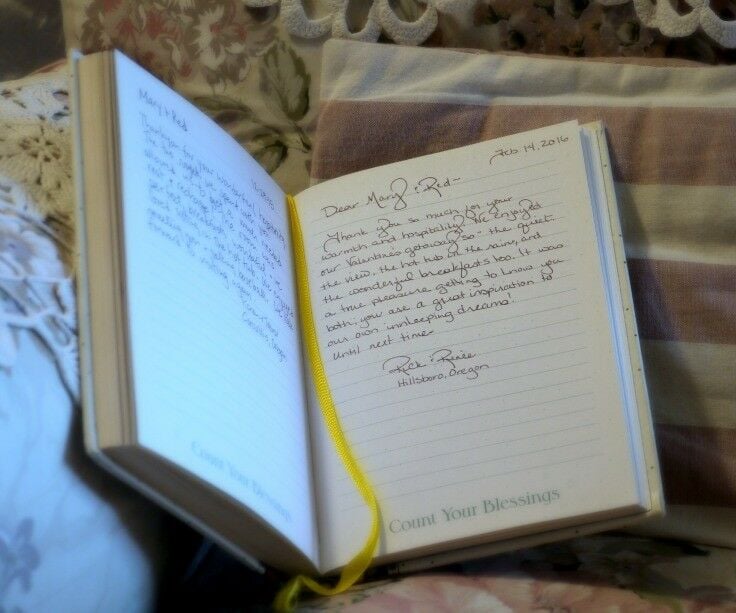 Guestbook entry in standard jouranl size blank book, yellow ribbon bookmark. 