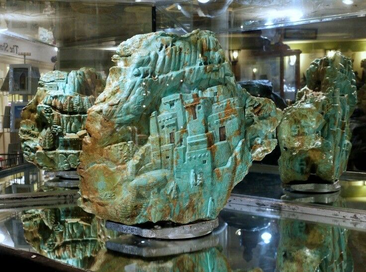 World's Largest Turquoise Carving, Elisabeth's by the Sea. 121 pounds; scene is a city by the sea. 