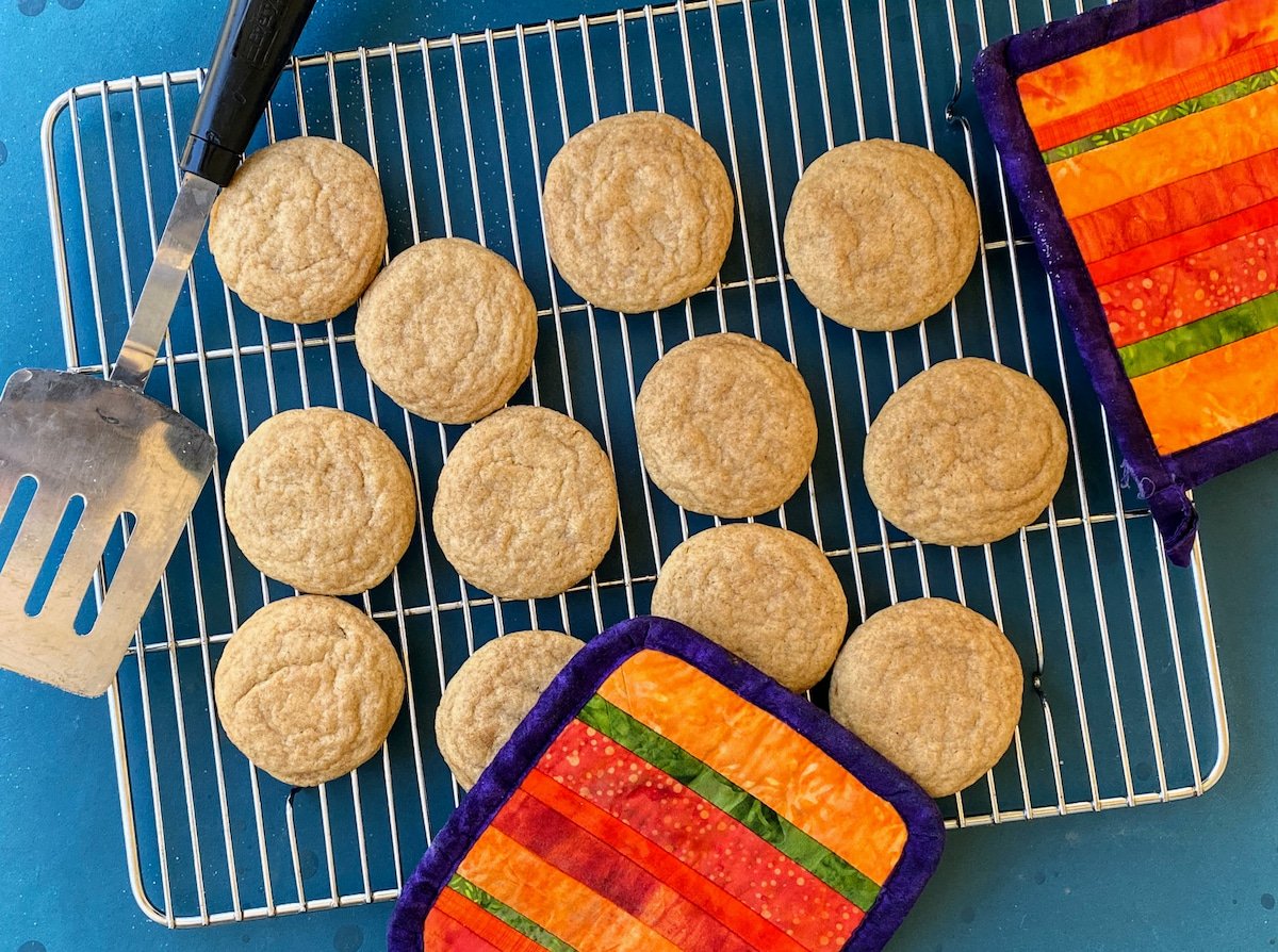 snickerdoodle cookies cooling on rack.