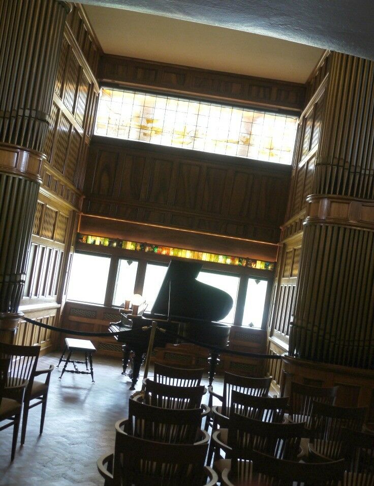 Music room with grand piano on display in Moran Mansion Museum Music Room. 