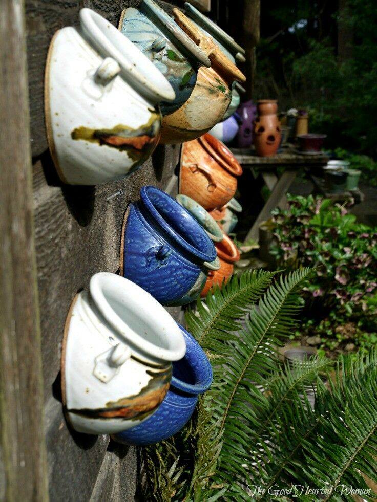 Colorful half-pots, with angle bottom for mounting on wall. 