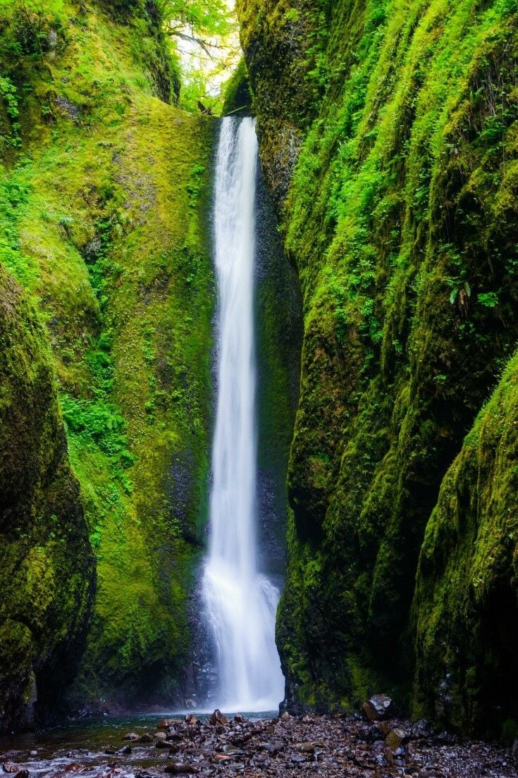 Waterfall coming down a moss-covered rock-face. Image credit: Waqas Mustafeez via Flickr (CC 2.0)