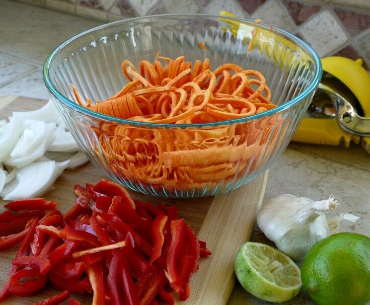 Spiralized Sweet Potatoes. sliced red peppers, onions, and limes. 