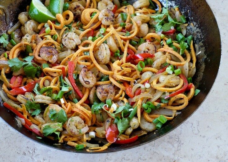 Spiralized Sweet Potato Pad Thai, cooked, in large wok. 