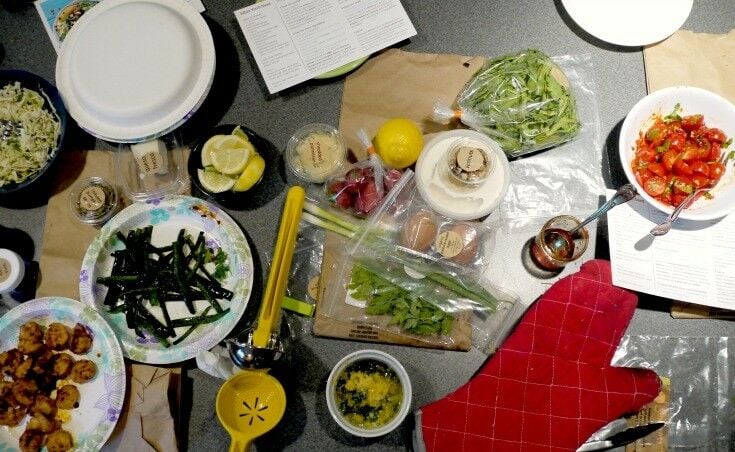 Ingredients for three meals on counter. Prep in progress. 