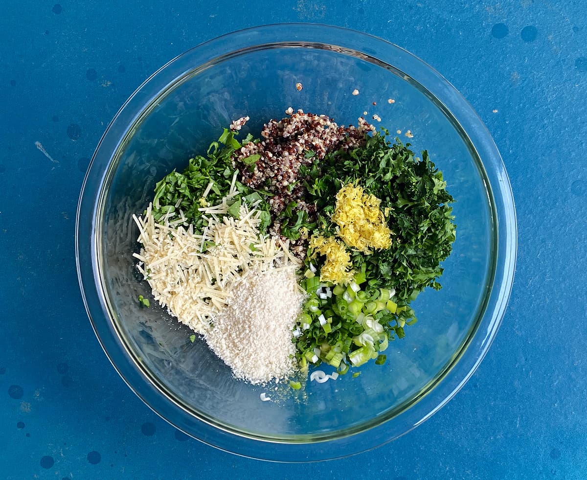 Ingredients for quinoa patties in a medium glass bowl.
