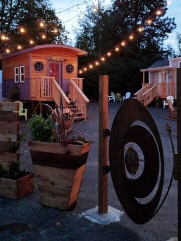 Exterior of Tiny Digs Hotel at twilight.