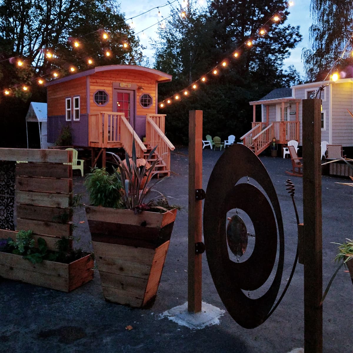 Exterior of Tiny Digs Hotel at twilight.