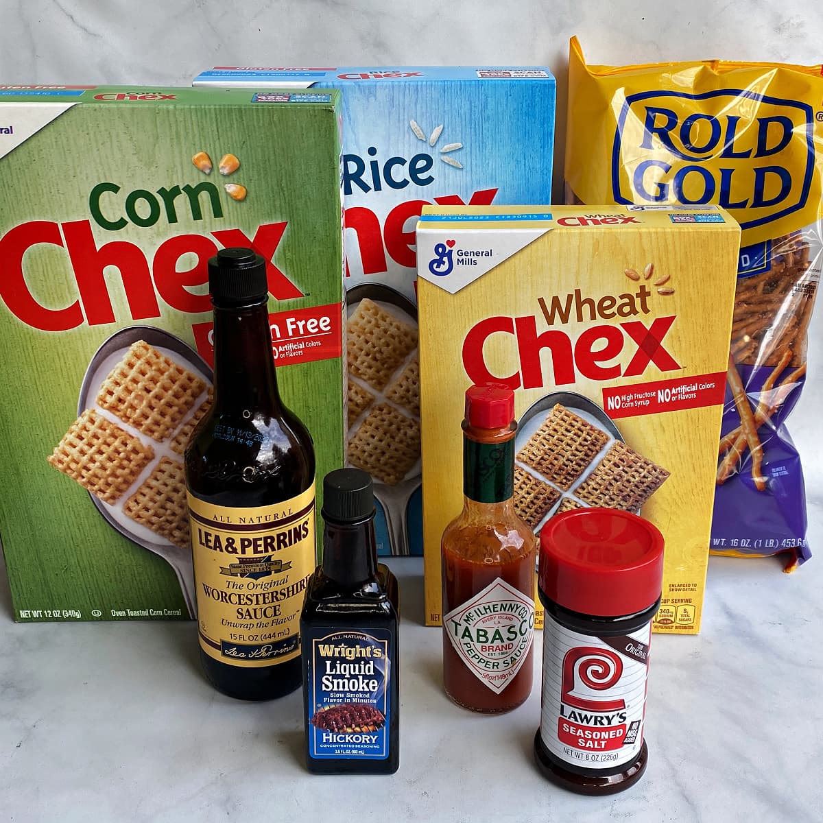 Photo of individual ingredients that go into this Nuts & Bolts (Original Chex Mix) recipe, measured and prepped.