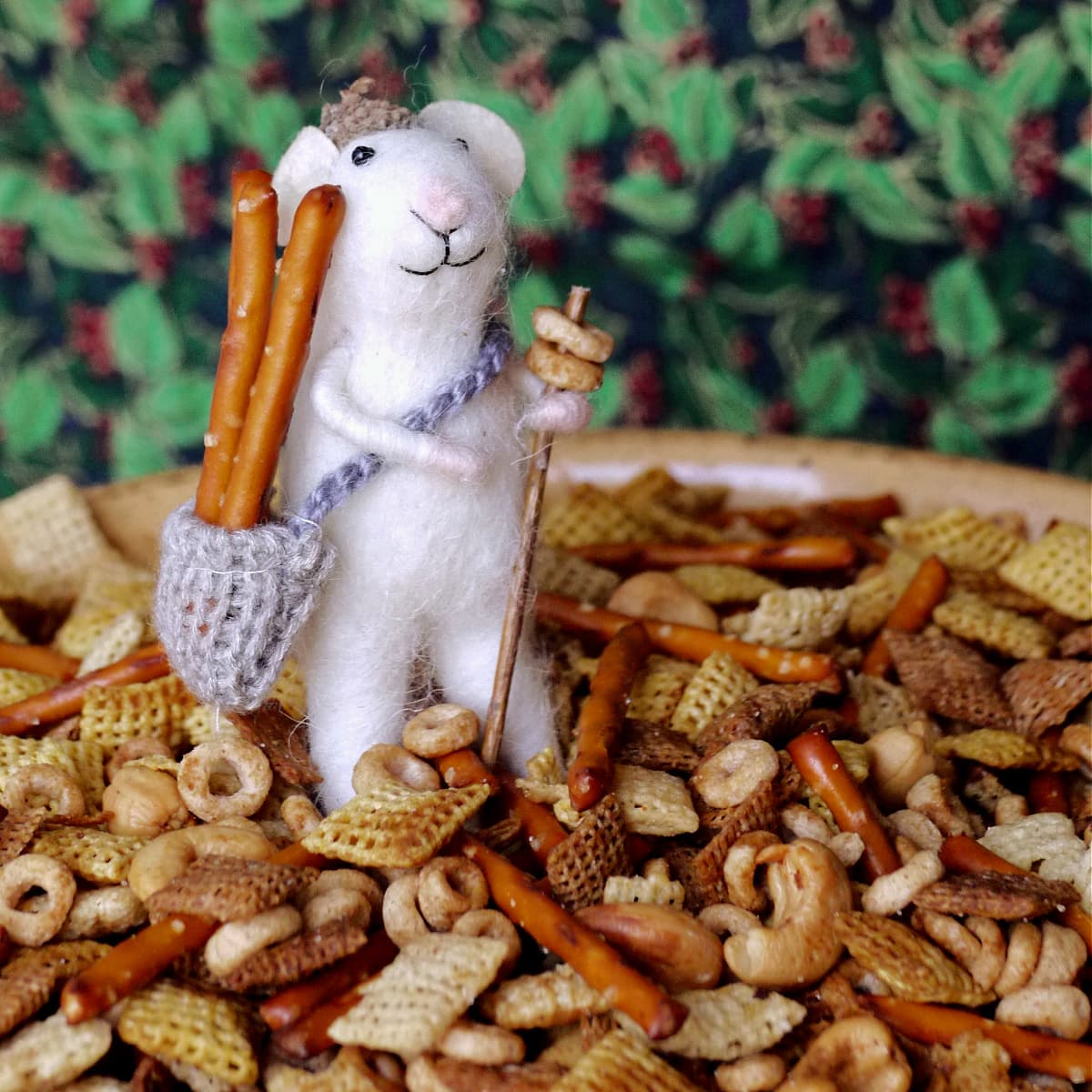 Close-up of a large bowl of Original Chex mix. Adorable felt mouse added for interest. 