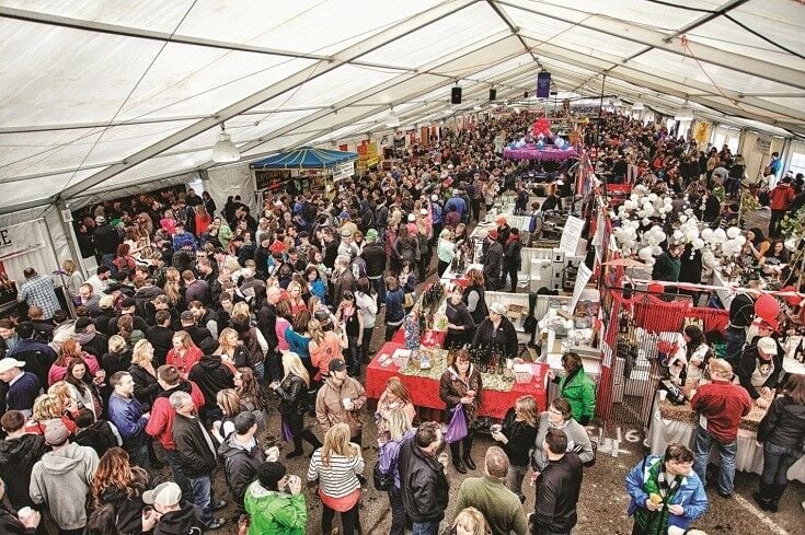 Overhead shot of crowd in tent at Newport Seafood & Wine Festival. Image Credit: Oregon Coast Visitors Association [Used with permission.]