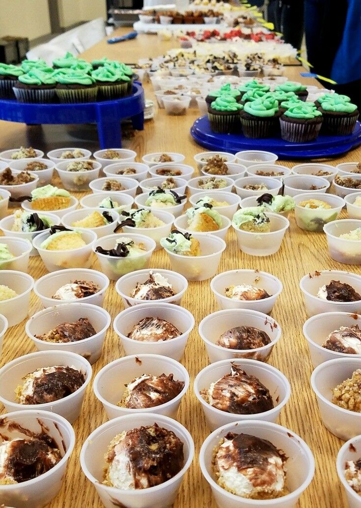 Long table of tasting samples at bake-off. 