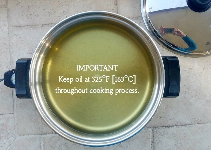 Overhead shot of electric skillet filled with cooking oil. Text overlay reads: IMPORTANT: Keep oil at 325°F.
