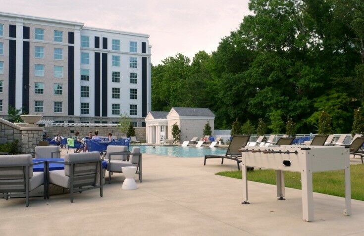 Outdoor rec area - foosball, pool, chairs. 