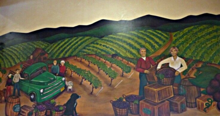 Wooldridge Creek Winery wall mural of people harvesting grapes. 