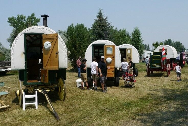 Basque sheep wagons lined up and open for tour.