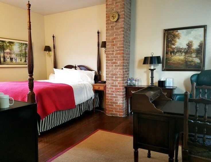 Bedroom interior with four-poster bed. 