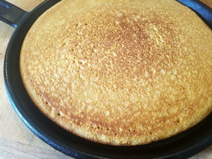 Baked cornmeal round "polenta" crust on cast iron griddle. 